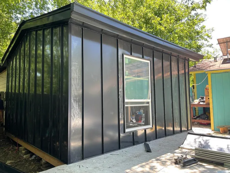 Black standing seam metal wall panels for Roof Inspection in Durham