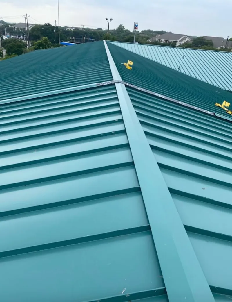 Green commercial metal roof ridge and valley for Metal Roof Repair in Durham